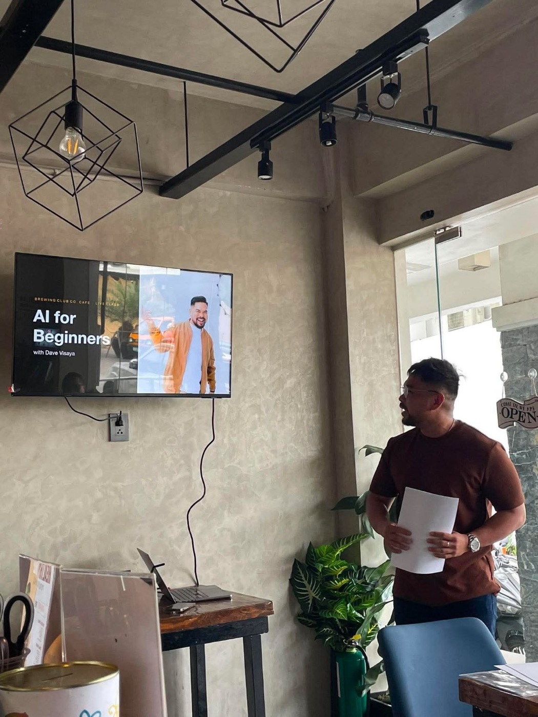 Dave Visaya presenting next to the AI for Beginners title slide