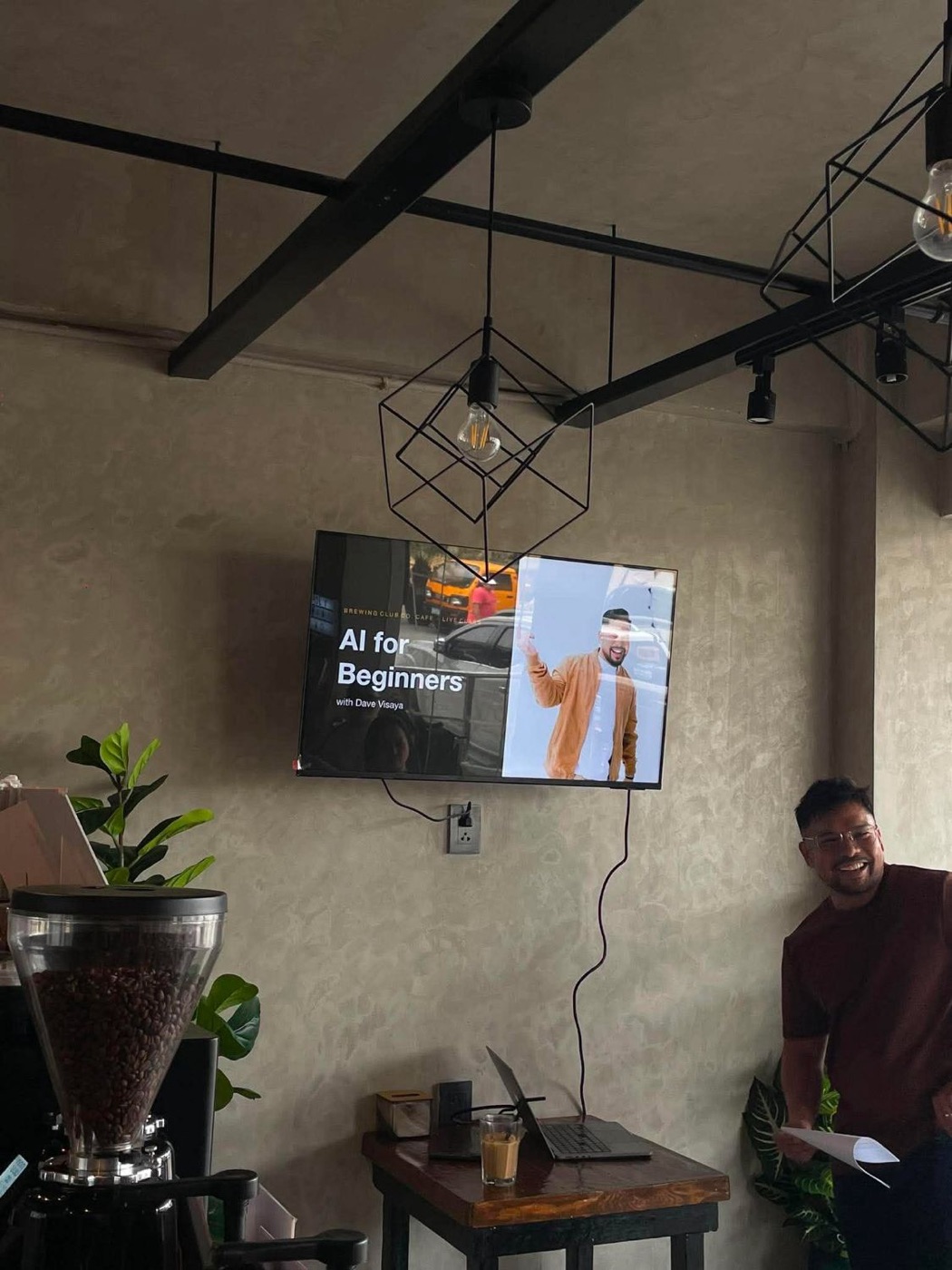 Dave Visaya laughing beside the screen during the AI for Beginners class