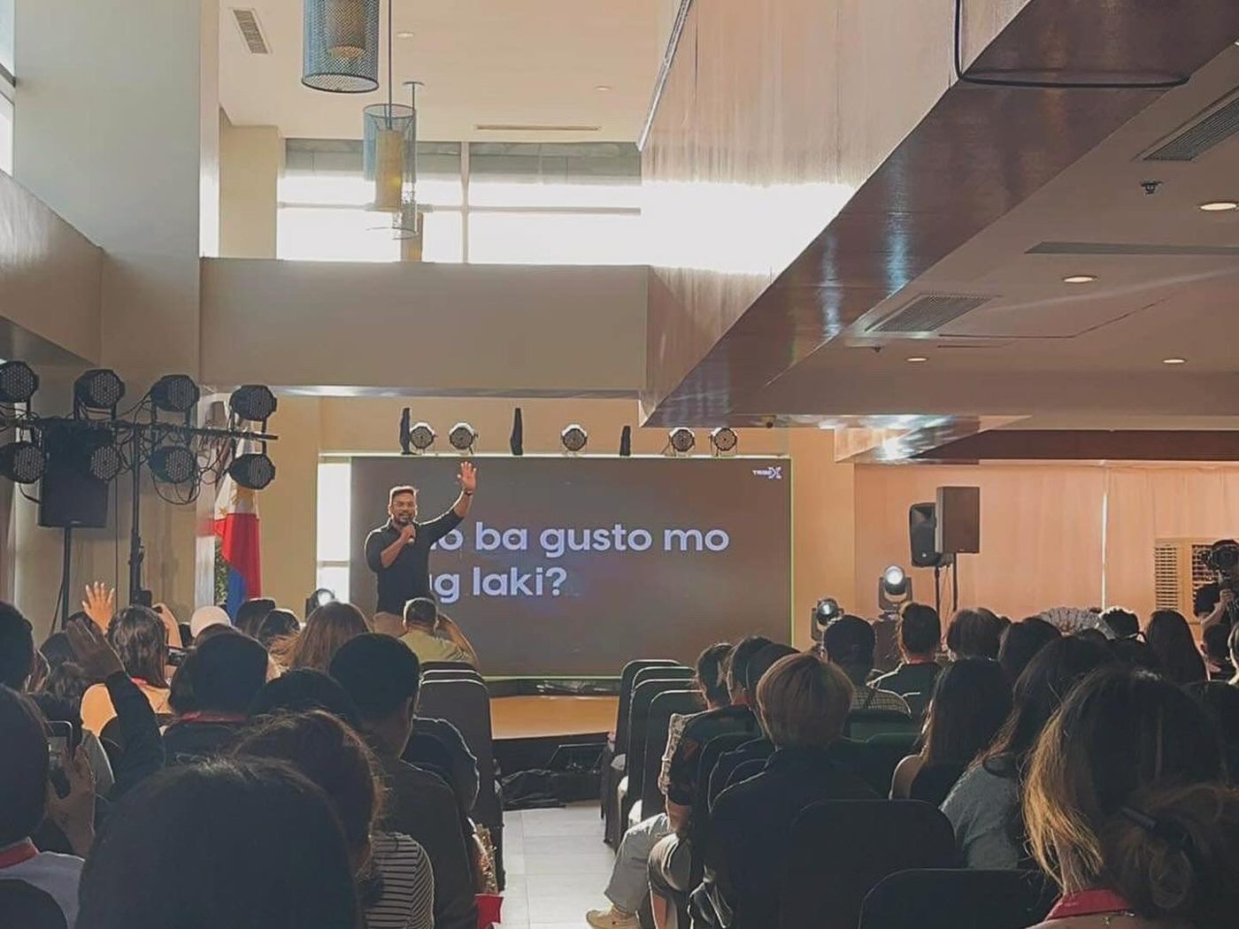 Dave Visaya speaking to a full room